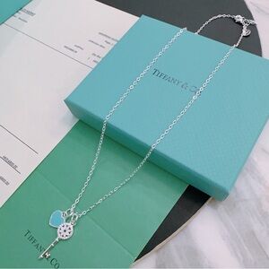 Tiffany & Co. Silver Key Necklace with Blue Heart Charm